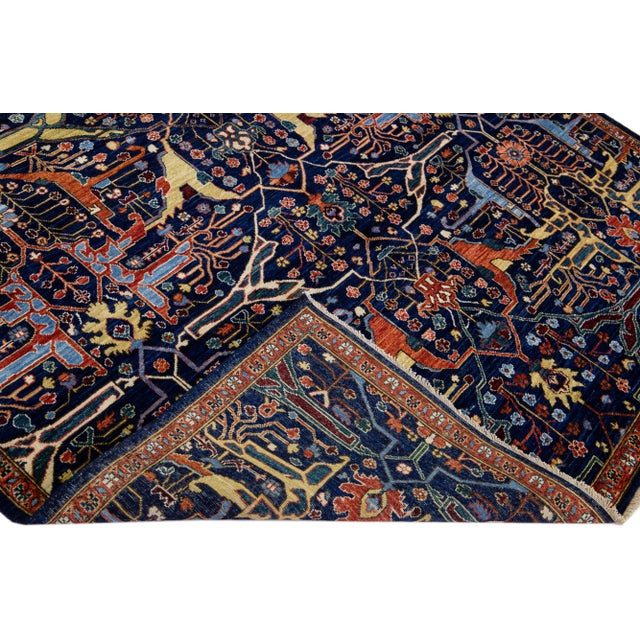 Beautiful modern Bidjar Style hand-knotted wool rug with a dark blue field. This piece has multicolor accents that feature...