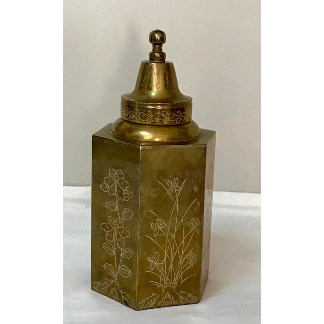 Hexagonal with straight sides and lift-off cover. Each side is engraved with a different variety of flower or foliage....