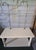A vintage shop cabinet with two 8mm shelves and a lower shelf, originally designed for various businesses in the early...