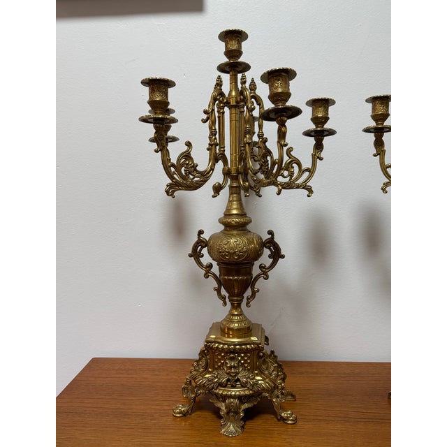 Elevate your interior with this impressive pair of French Rococo Revival gilt metal candelabra, each standing a commanding...