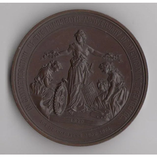 An antique bronze medallion celebrating 100 years of American independence. “In commemoration of the hundredth anniversary...