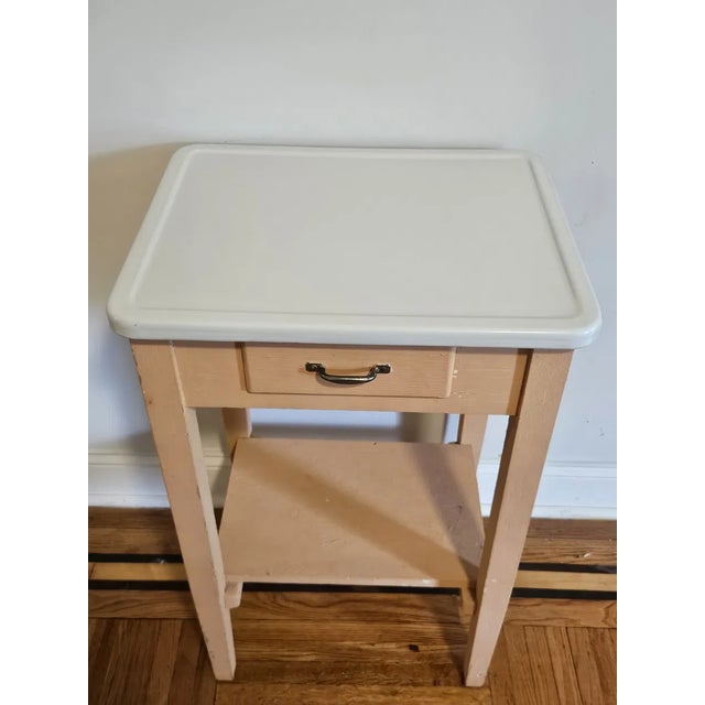 A charming and highly functional antique nightstand or bedside table, likely French or Continental in origin, dating to...