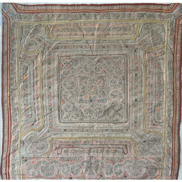 Capture a piece of Southeast Asian heritage with this exquisite antique Hmong "Paj Ntaub" (flower cloth). This museum-...