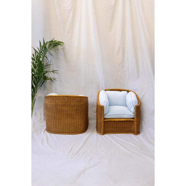 Pair Of Woven Wicker Armchairs – Attributed To Vivai Del Sud – 1970s Continuous frame in wood and woven wicker, featuring...