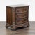 This walnut and burl veneer nightstand has a serpentine shaped top with burl crossbanding over the serpentine case of...