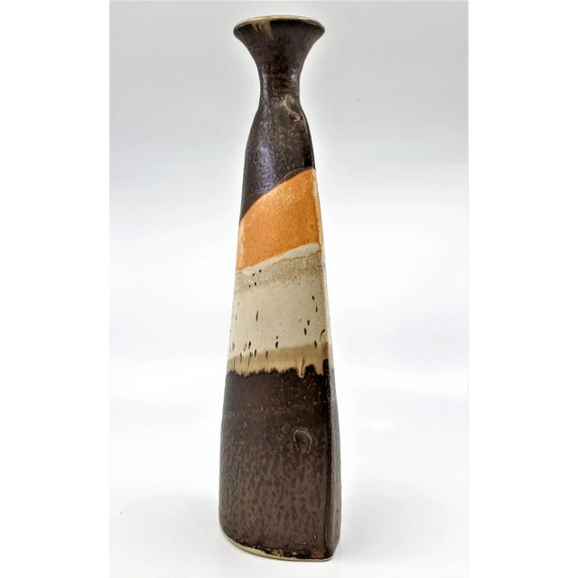 Offering a tall Studio Art Pottery vase, circa 1970s. This Organic Modern vase has a wonderful natural earthy glaze...