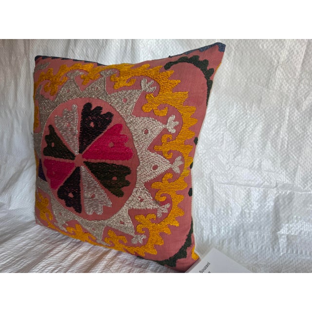 This vibrant 1900s Suzani pillow was handcrafted using traditional embroidery techniques passed down through generations....