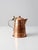 A beautifully crafted vintage teapot in warm hammered copper, accented by an elegant brass handle. Its tapered form, domed...