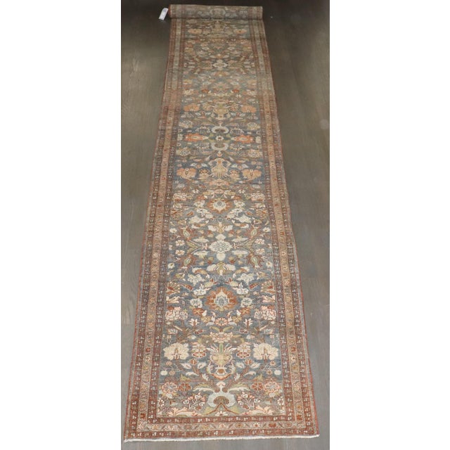 An early 20th-century narrow and extremely long floral Persian malayer runner