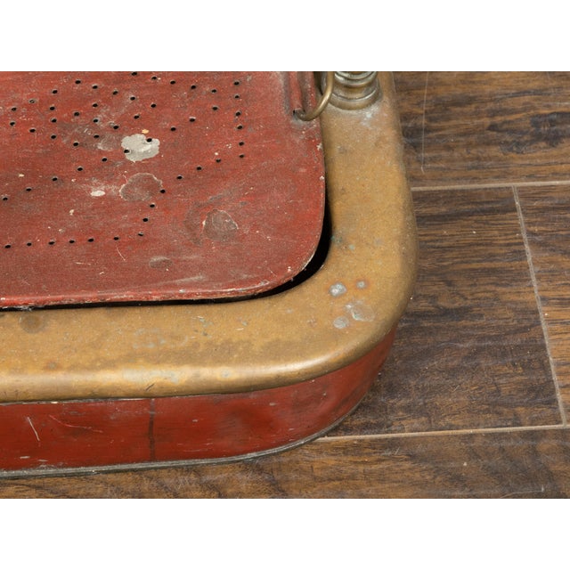 An English Victorian period brass umbrella stand from the 19th century, with petit finials, red accents and removable low...
