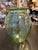 The product is an 8" vase by Anchor Hocking featuring a Cameo Ballerina pattern. The vase is made of green uranium glass,...