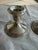 A classic pair of vintage weighted sterling silver candlesticks featuring an elegant, understated design with finely...
