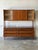 This impressive two-piece unit features a spacious six-drawer base beneath a sleek hutch with smooth sliding doors. The...