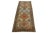 Beautiful antique Persian hand-knotted wool runner with a beige color field. This piece has rust, green, and blue accents...