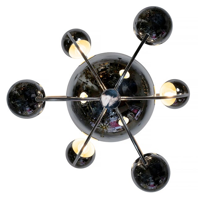 Italian mid-century space-age chandelier by reggiani from 1960-70s. the chandelier is made in chrome metal. bulb holders:...