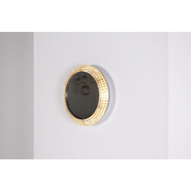 Circular beveled mirror mounted on metal, decorated with 4 rows of rhinestones. Probably edited by palwa or bakalowits &...