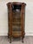This is a gorgeous antique American Victorian–Edwardian quarter-sawn bow front oak china cabinet, display cabinet, or...