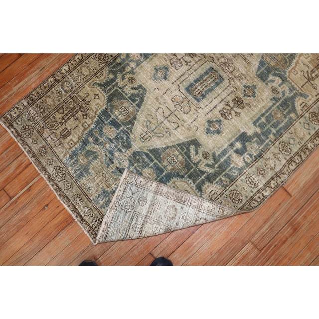 A small size early 20th-century Persian worn rug Measures: 3'3" x 4'10".