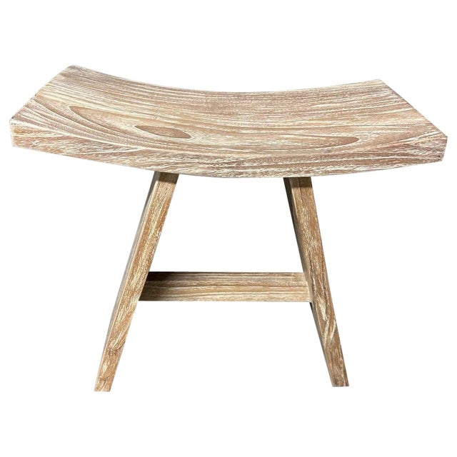 Sleek minimalist bench or stool hand made from a single slab of reclaimed teak wood with a cerused finish revealing the...