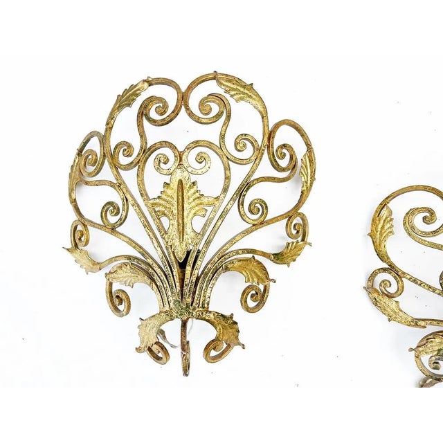 Pair of Gold Wrought Iron Appliques attr. Colli '50 -Design- Year: around 1950 attr. Pierluigi Colli Materials: Wrought...
