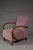 This elegant Art Deco club armchair originates from Poland and dates to the 1930s. The chair features a compact, well-...