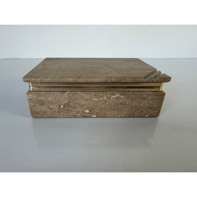 Beautiful vintage rectangular box crafted from solid travertine marble, featuring a warm earthy tone with natural porous...