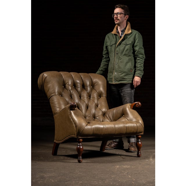 Classic leather Sleepy Hollow chair characterized by its deep, low-slung seat, pronounced recline, and enveloping, high...