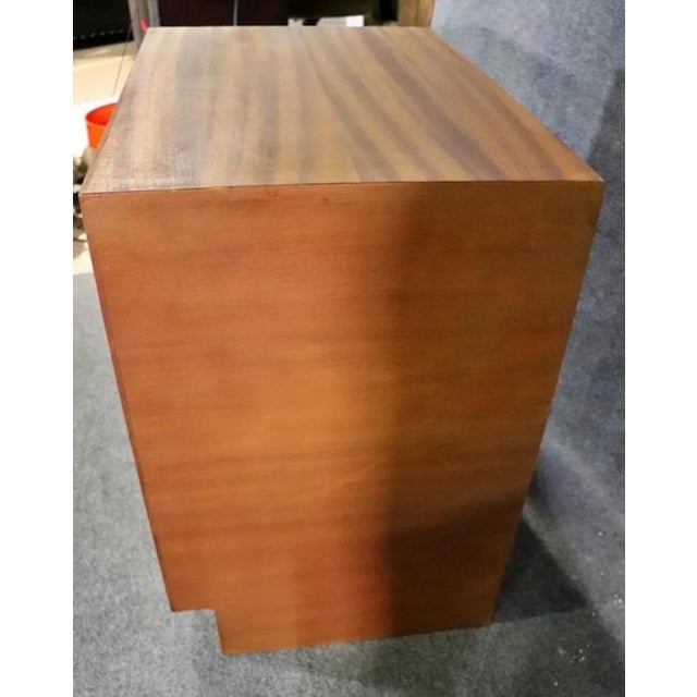 Set of teak cabinets made by the Buchner Company. One has 4 drawers and measures 30" h x 30 1/8" w x 20 3/4" d. One has 2...