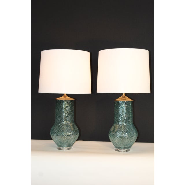 Pair of Murano glass lamps. . Unusual design in the glass, lending itself to Moorish influence. Soft teal blue and...