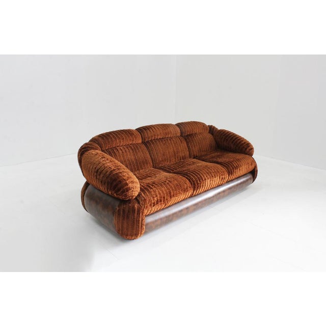 Vintage Italian 3 seater sofa from the 1970s in a beautiful warm orange corduroy velvet fabric and brown details....