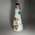This white ceramic vase with decoration is stamped and part of the Filatelia series, signed Titian. It features polychrome...