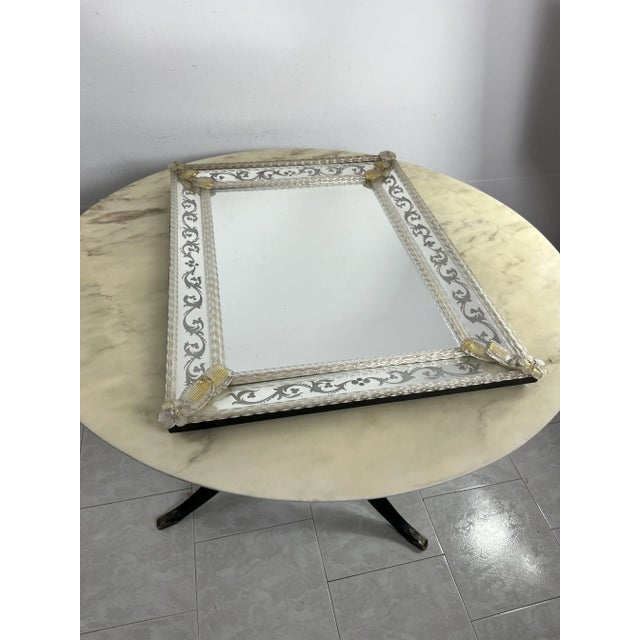 Mid-Century Venetian wall mirror in Murano glass from the 1960s Intact and in good condition, found in a noble apartment....