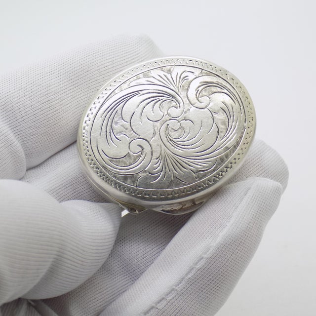 Vintage oval box with a classic, refined elegance, beautifully hand engraved and crafted in italy between the 1970s and...