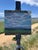 Bow Mar Blue Skies by Michael Magrin | Oil on Linen Landscape with blue skies and distant mountains For Sale
