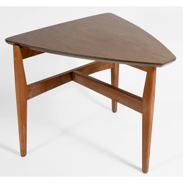 A vintage mid-century modern "guitar pick" side table, potentially manufactured by Brown Saltman.