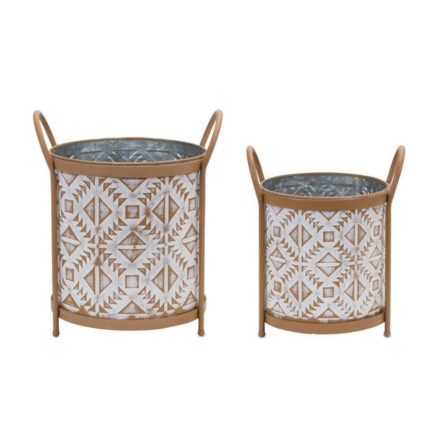 Elevate your home or garden decor with our Footed Metal Aztec Planter Set. Featuring a chic combination of distressed...
