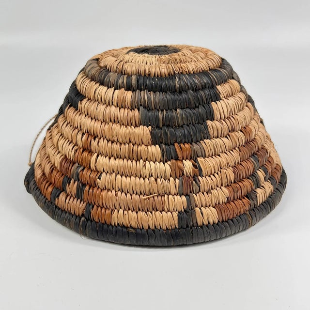 This handwoven basket from Botswana reflects a long-standing tradition of fiber artistry shared across southern Africa,...