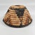 This handwoven basket from Botswana reflects a long-standing tradition of fiber artistry shared across southern Africa,...