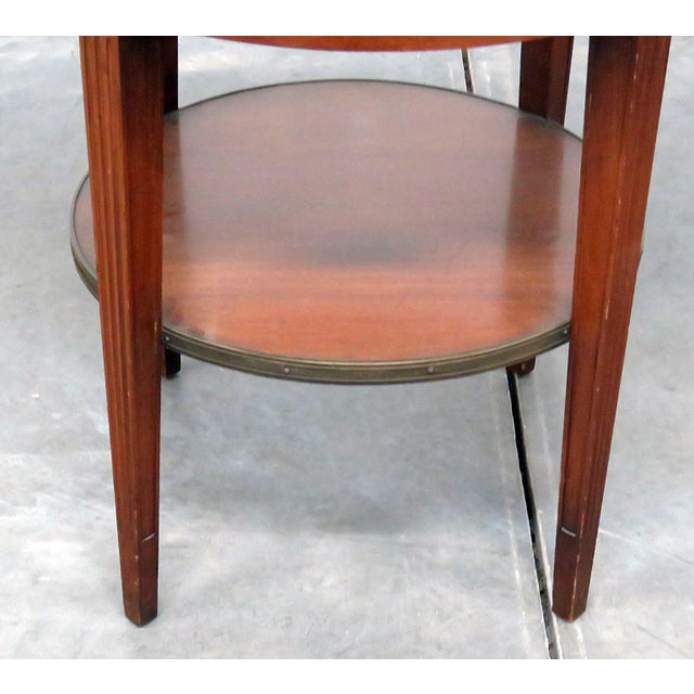 Regency style 1 drawer leather top bouillotte table with a brass gallery. Made in the early 20th century.