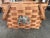 This is a great organizational and decorative basket with split wood that is woven with 2 handles. There is an eagle...