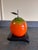 A fun pop art style sculpture of a multicolored apple on black wood base. The apple is made of solid turned wood and shows...