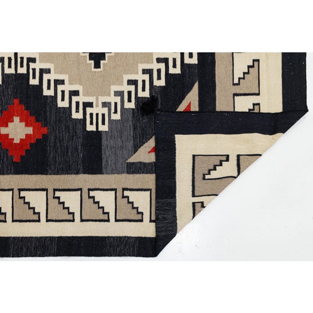 Elevate your space with this striking Modern Navajo style hand-woven wool rug, designed for high-end residential...