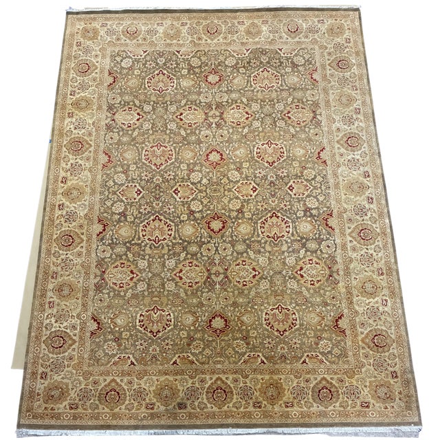 A beautifully hand-knotted Indo-Persian Agra style wool rug featuring an elegant allover floral design in warm taupe,...