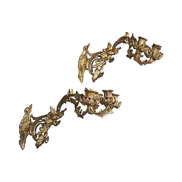 Pair of antique English Aesthetic Movement brass acanthus leaf and floral candle sconces. The high-relief backplates...