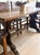 A showstopper of a piece, this antique French dining table features a fruitwood top set over an oak and ash trestle base....