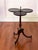 A Georgian style walnut dumbwaiter or drinks table with three individual round tabletops and a handle, circa 1940. A...