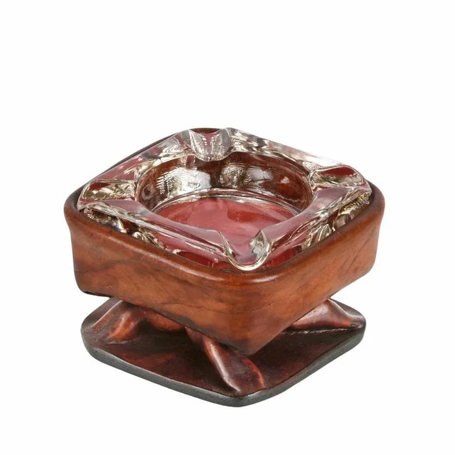 Superb ashtray with a leather body and glass top. This fantastic item is attributed to Jacques Adnet and was produced in...