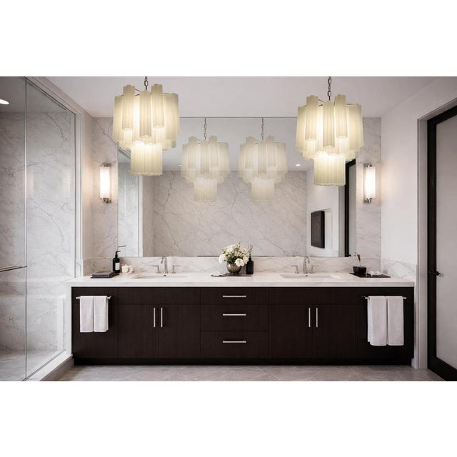 Italian vintage glass chandelier with albaster white glass tubes. The armor polished nickel supports 36 large etched glass...