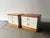 A pair of Mid-Century bedside cabinets by Stag dating from the 1960s. Each cabinet has two drawers with circular recessed...