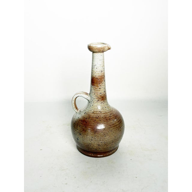 A ceramic vase from Le Marais, France, dating from the 1950s, boasts a handcrafted design and authentic charm. This piece...
